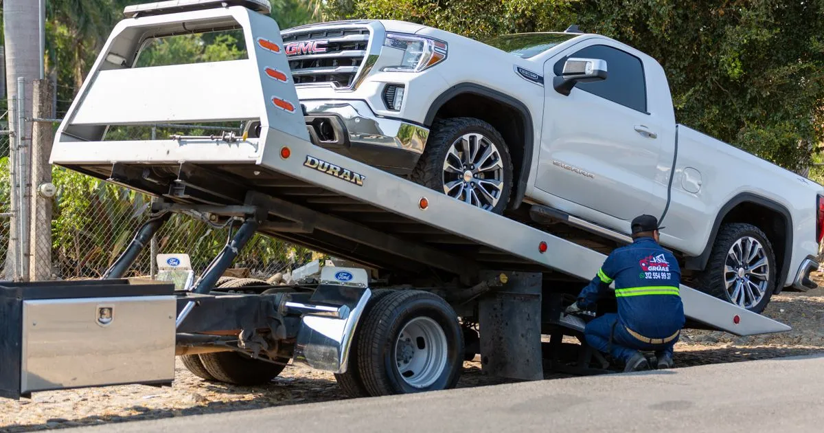 Tow truck loading a vehicle - car repossession Ontario rights and process