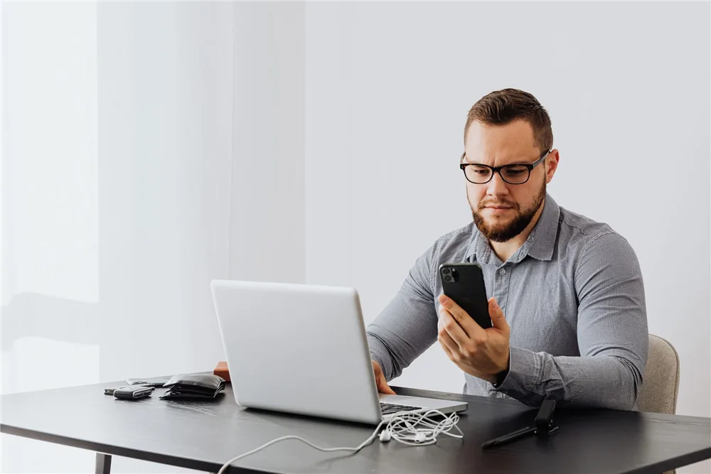 Man checking the credit score he needs for a car loan in Canada
