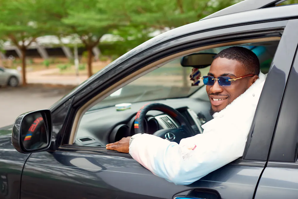 Man driving his car after getting approved for a bad credit car loan in Canada