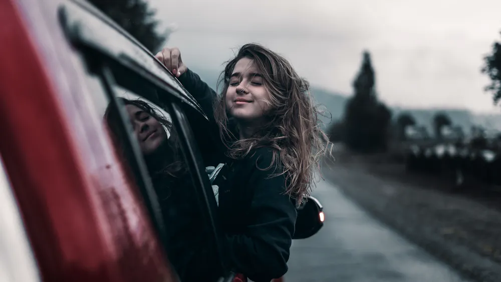 Driver moving forward on the open road after rebuilding with a car loan in Canada