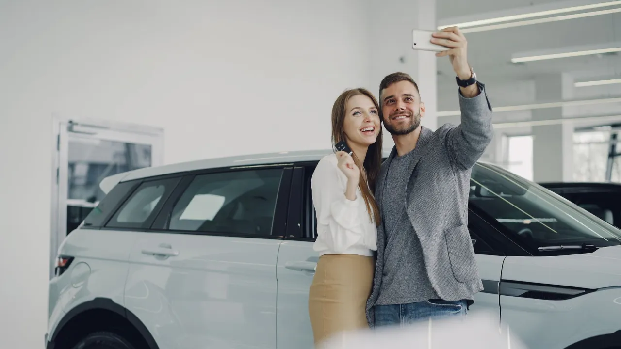 Couple celebrating an approved bad credit car loan in Edmonton