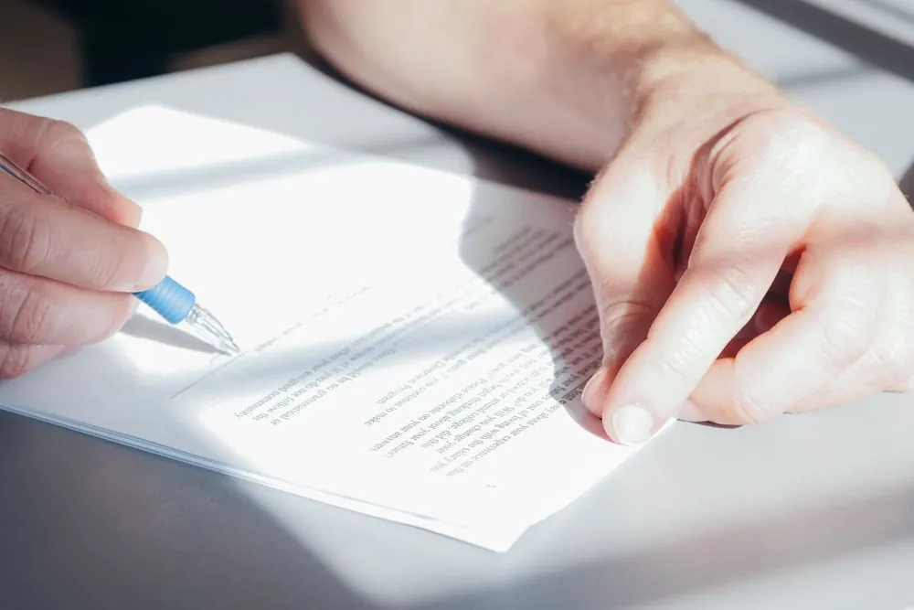 Signing consumer proposal car loan documents with a Canadian lender