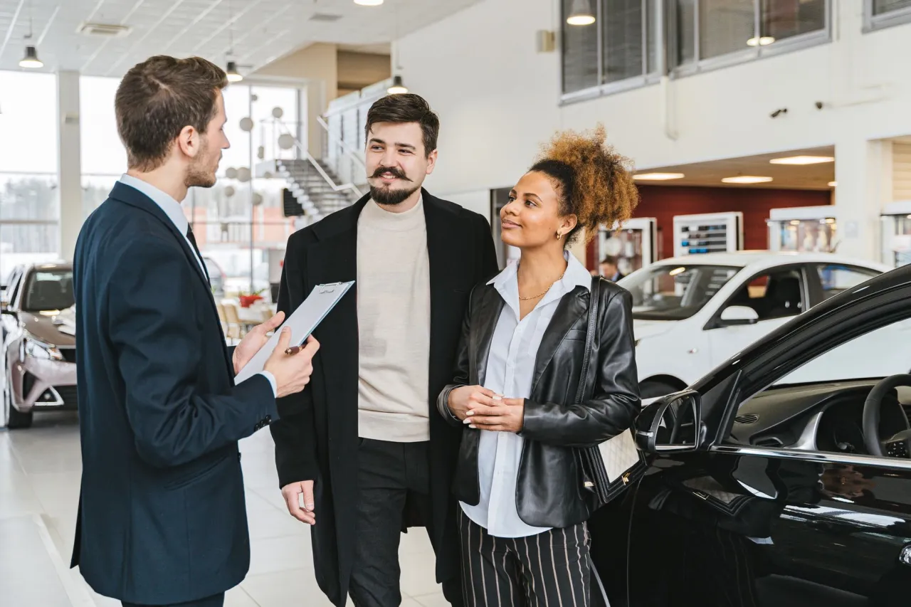Talking through lease and finance options with a dealership advisor