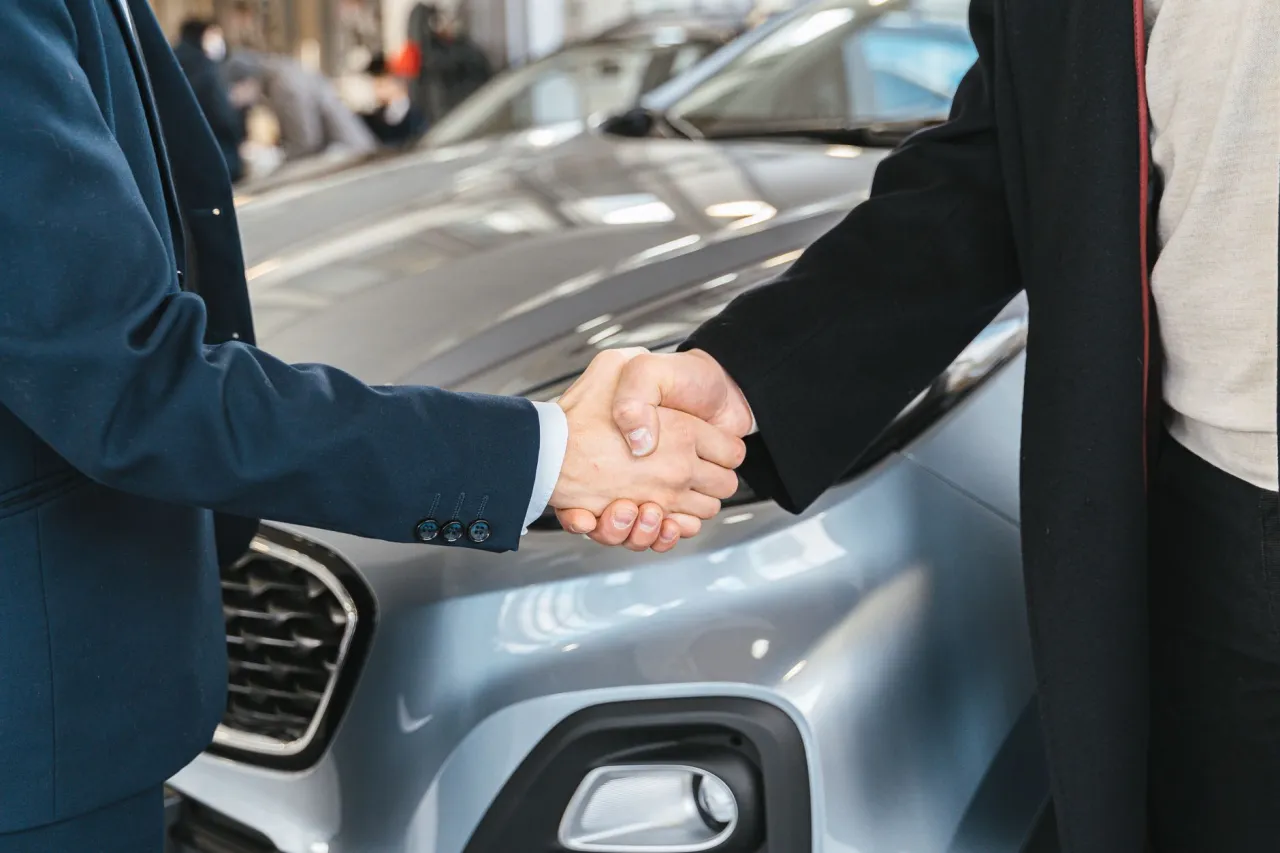 Closing the sale of a financed car with a handshake