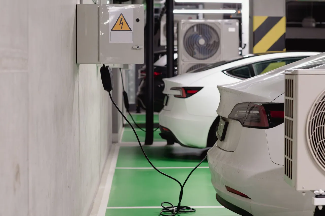 Electric cars charging overnight in a condo parking garage