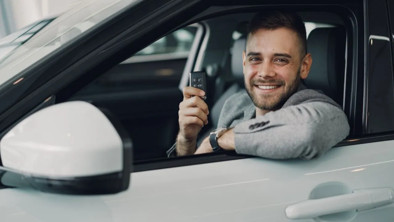 Driver picking up keys to a financed car instead of a rent to own vehicle