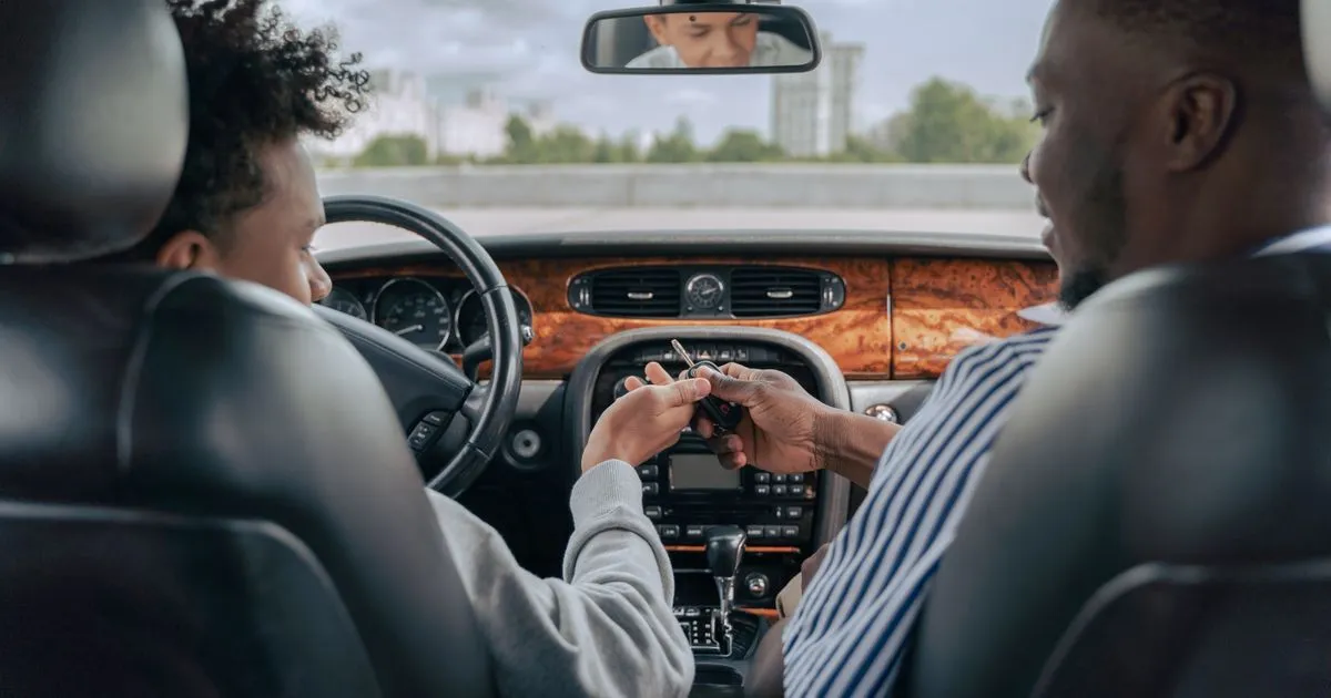 Father handing over the keys after deciding to gift a car in Ontario to his son