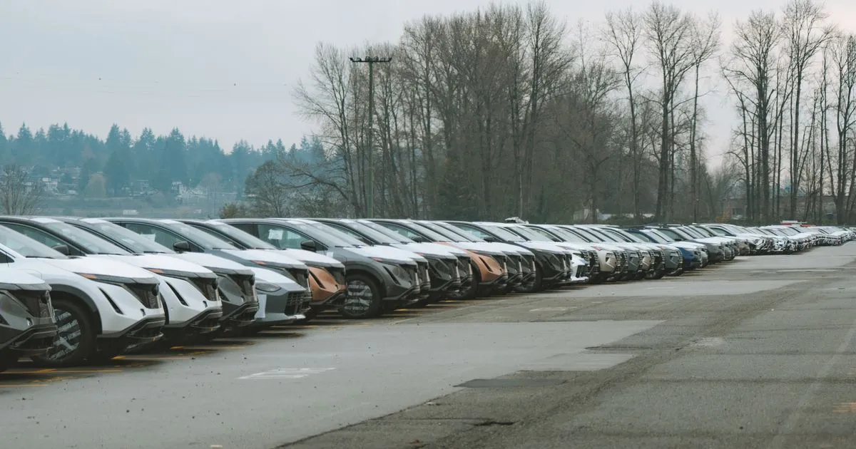 Rent to own cars on a Canadian dealer lot with payment signs