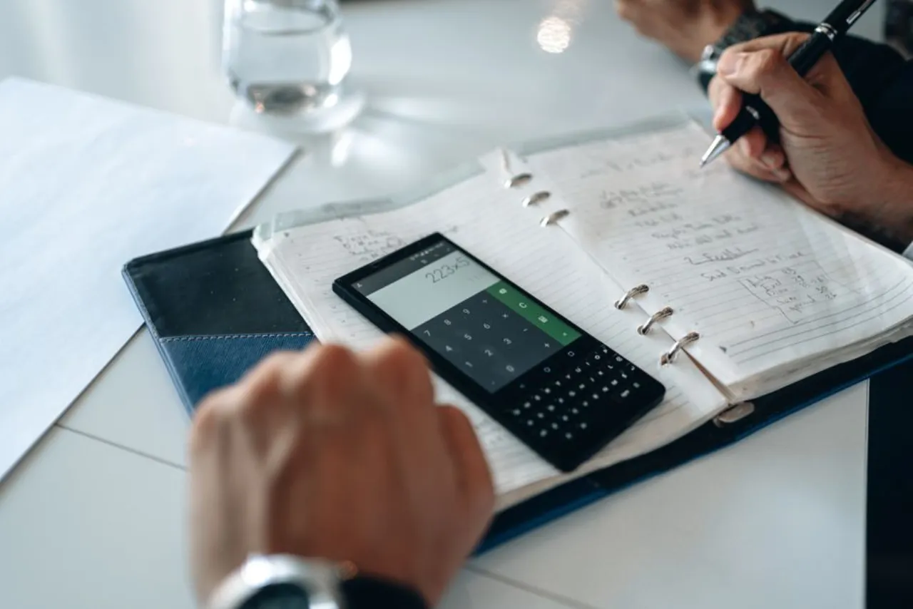 Weekly payment math for rent to own cars added up on a calculator